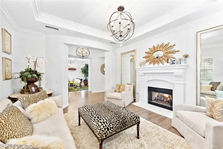Stunning formal living room with dual sided fireplace to dining room