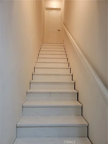 Stairs to upstairs garage.