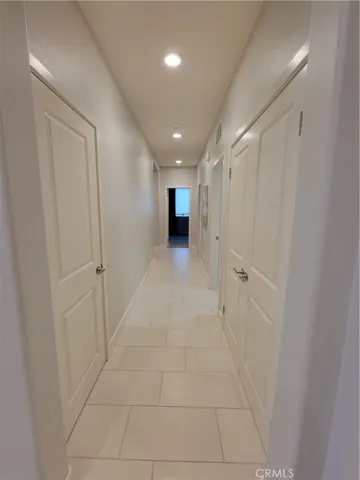 Hall to master, laundry, bed, and garage.