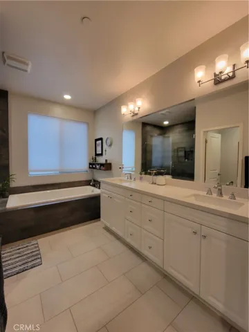 Double sink vanity lots of light.