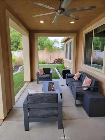 Clean covered relax out doors with ceiling fans to keep fly's out.