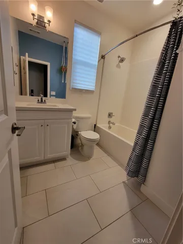 Full Shower bath combo.  Subway tile fiberglass.
