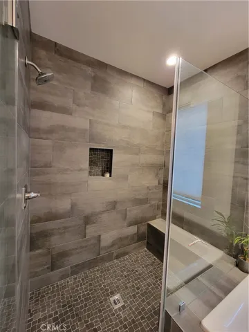 Master Walk in shower with seat.