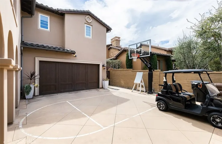 courtyard, basketball, and golf cart garage