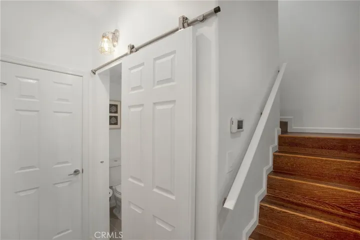 Barn style door to powder room with sensored auto light when occupied