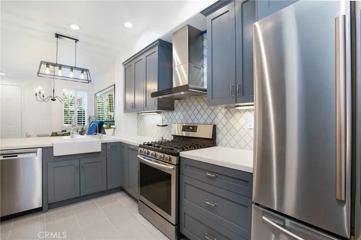 5 burner range with range hood ad 3 door refrigerator included