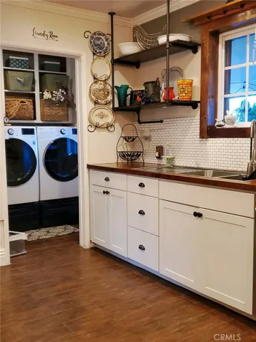 Kitchen with view of laundry room