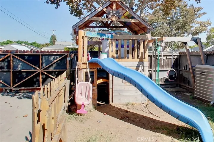 Backyard play set and gate for driveway.