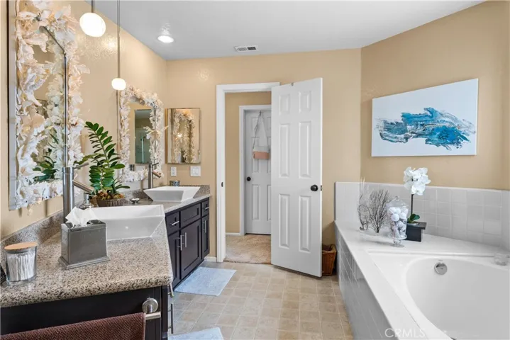 Primary Bathroom with custom mirrors and lighting