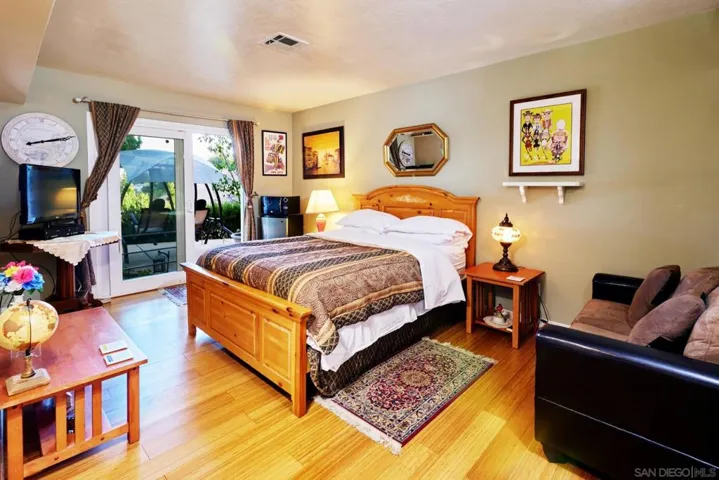 One of four bedrooms, this one is used as Airbnb lodging: private entry/exit to outside and to the inside of the house, full guest bath and large closet.
