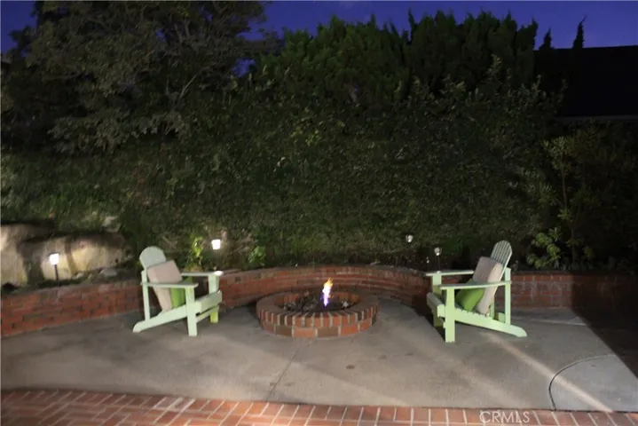 Spacious private backyard with firepit.