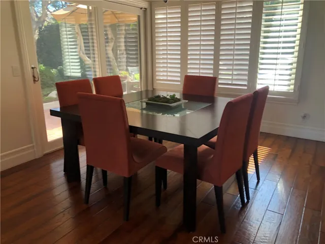 Dining room with outdoor access and large windows, providing lots of natural light.