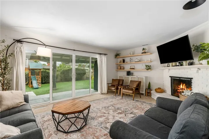 Great size living room with cozy fireplace.