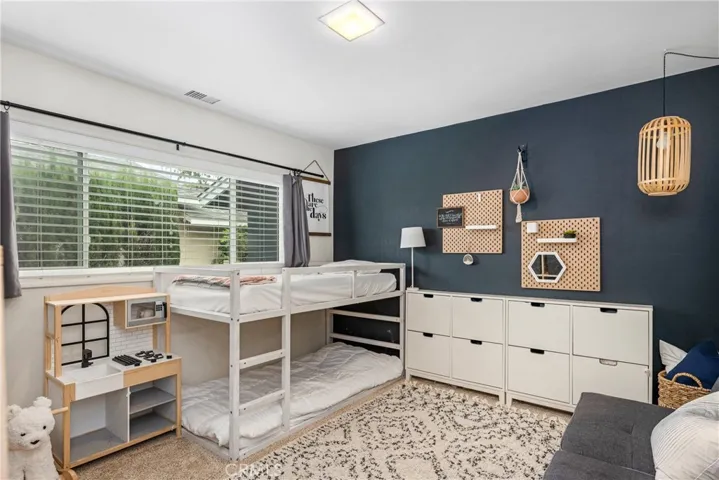 2nd Bedroom with great accent colored wall.
