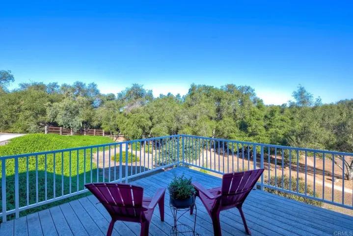 The patio decking wraps all the way around the back of the home providing those amazing views!!