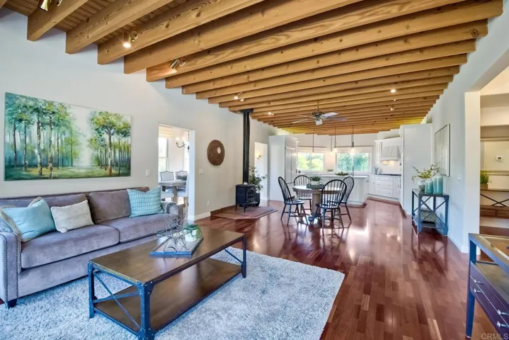 As you enter, you're greeted with the beautiful wood beam ceilings.