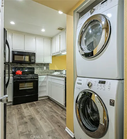 Inside laundry area adjacent to the kitchen