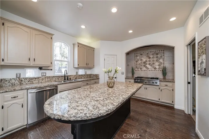 Island provides extra space for food prep and breakfast bar