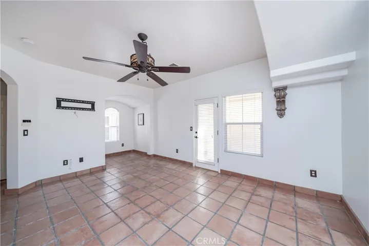 Tile flooring and decorative ceiling fan.