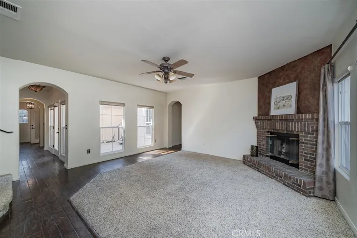 Brick fireplace in living room.