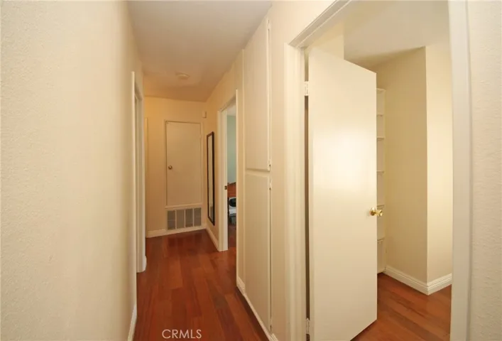 Hallway leads to 3 bedrooms and 2 bathrooms