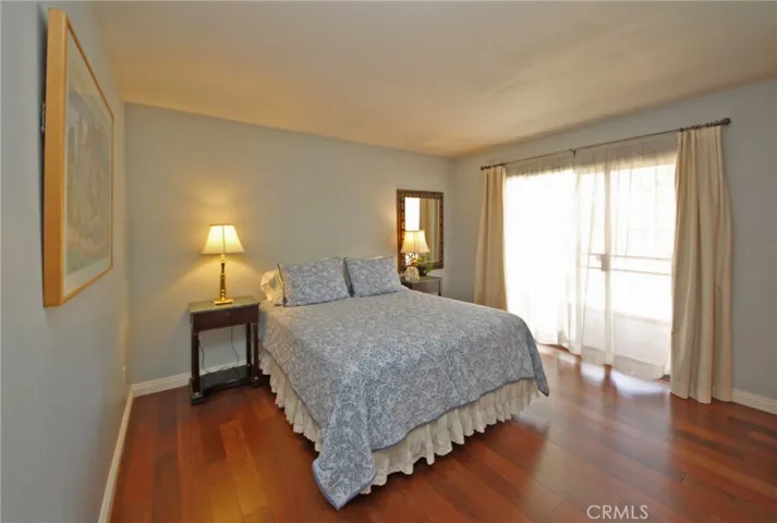 Master bedroom with a sliding glass door to the patio