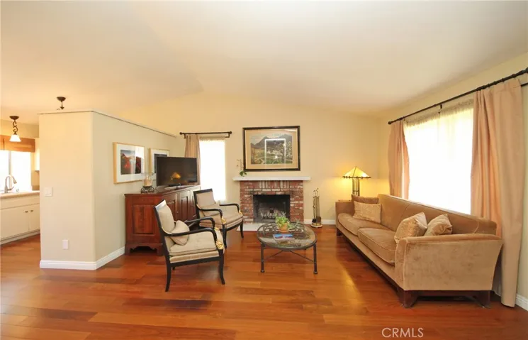 Large brick fireplace with a mantle