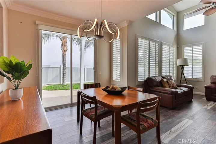 Crown molding and shutters accent this beautiful space.