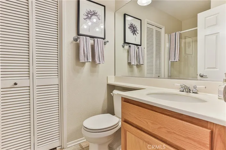 Downstairs full bathroom features a large walk in closet.