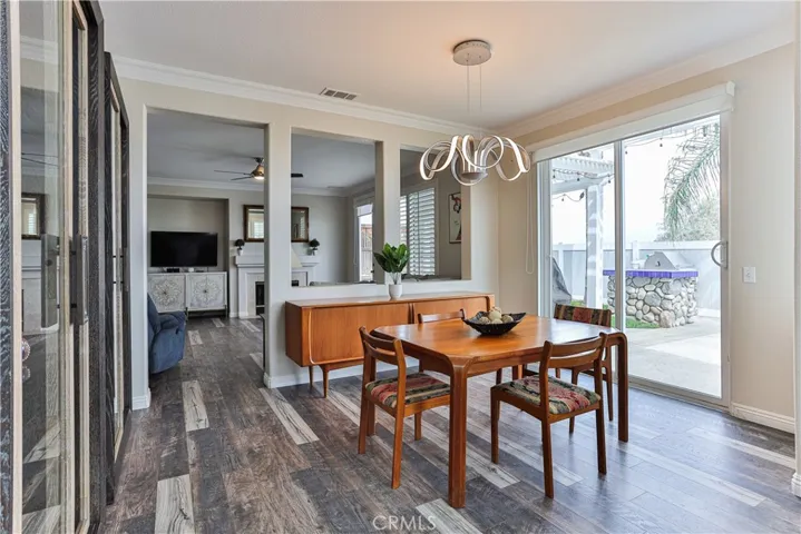 Formal dining room opens to the family and has a sliding glass door to the backyard.