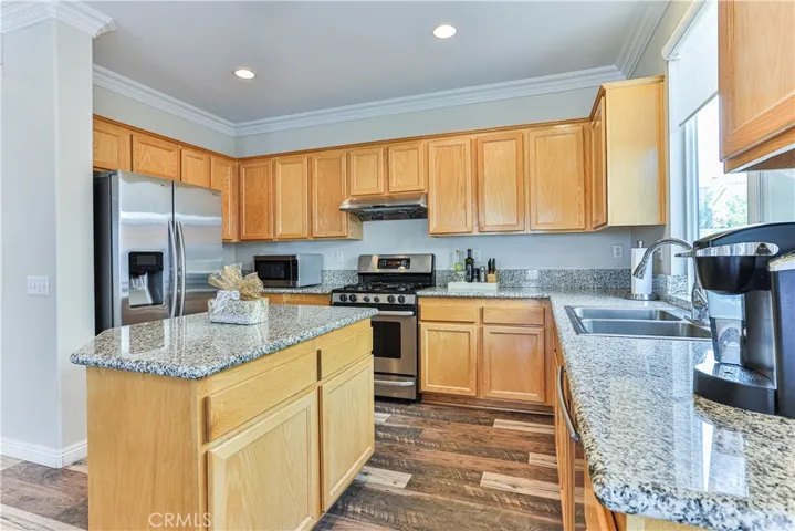Features include crown molding, stainless steel appliances and granite countertops.