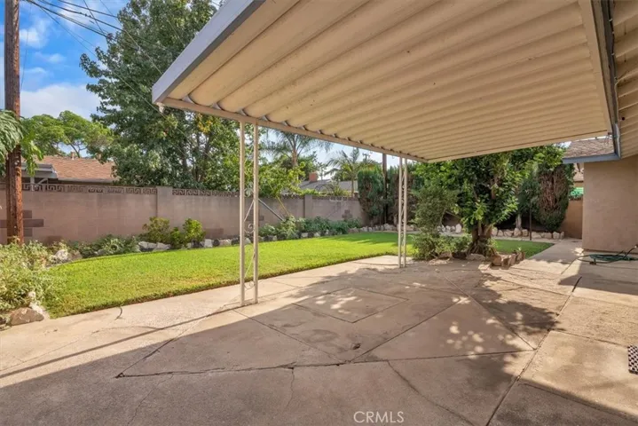 Large 5,458 square foot Lot * Beautifully Landscaped * Spacious Backyard Surrounded with Block-wall Fencing * Backyard includes a Covered Patio Ideal for Barbeques and Entertaining Family and Friends