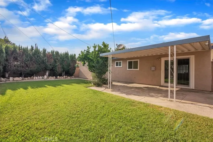 Large 5,458 square foot Lot * Beautifully Landscaped * Spacious Backyard Surrounded with Block-wall Fencing * Backyard includes a Covered Patio Ideal for Barbeques and Entertaining Family and Friends