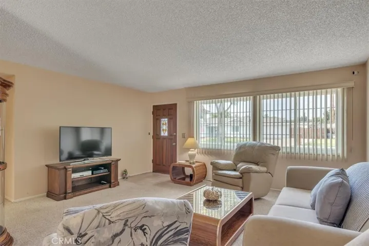 Different angle of Spacious Living Room with Upgraded Dual-Pane Vinyl Frame Windows
