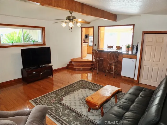 Steps from kitchen into garage-converted family room