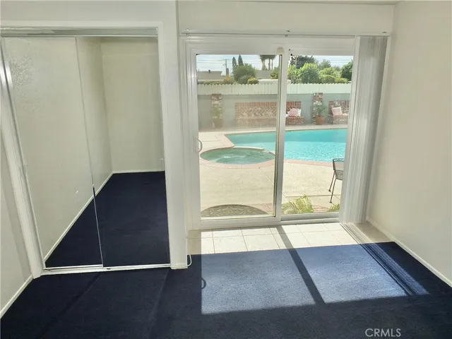 Bedroom 3 leading to backyard and pool