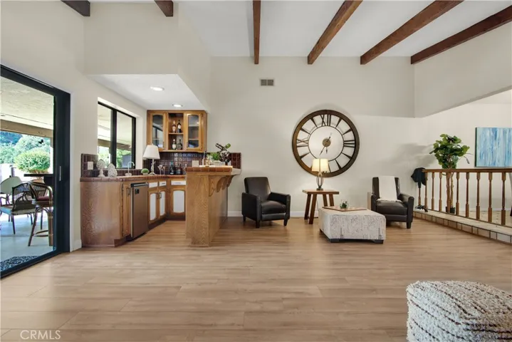 Family room also features a built in wet bar with refrigerator