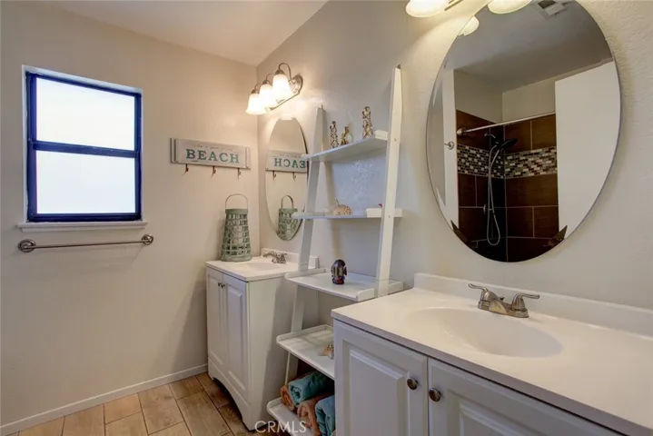 Primary bedroom ensuite with dual vanities