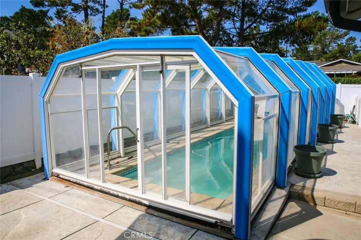 Enclosed & heated lap pool is just outside the master bedroom.