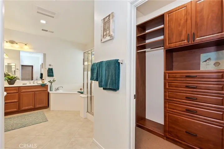 CUSTOMIZED CLOSET IN PRIMARY BEDROOM