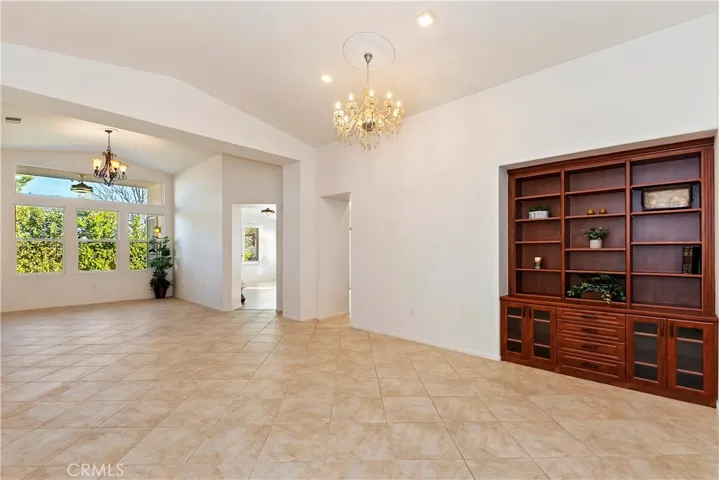 LIVING ROOM - SPECIALTY LIGHT FIXTURES AND BEAUTIFUL BUILT-IN CABINETRY