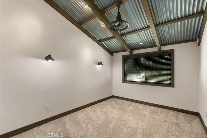 Additional bedroom with a rustic decor