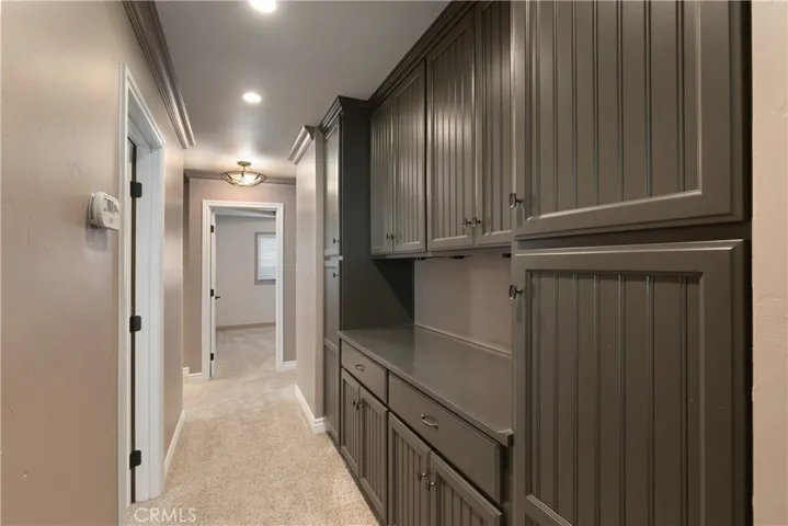 Hallway with beautiful wall to wall cabinetry