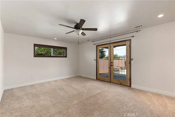Additional view of Owner's Suite with ceiling fan
