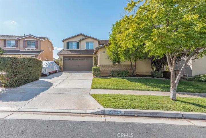 Big driveway with 3 car garage.
