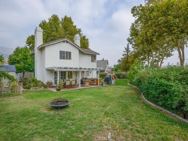 Deep backyard showing side yard and additional space to the right side.