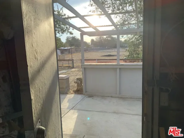 View into back yard from Garage.