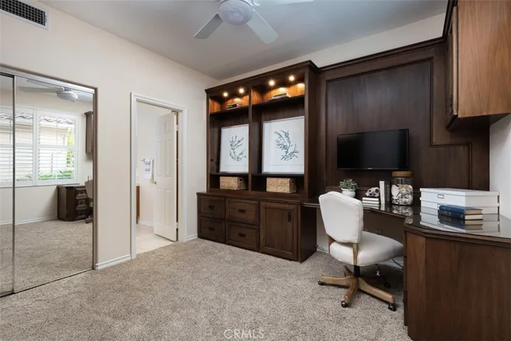 Main Floor Secondary Bedroom with Furniture Quality Murphy Bed, Exquistie built-in Office area.  All bedrooms feature private full bathrooms.