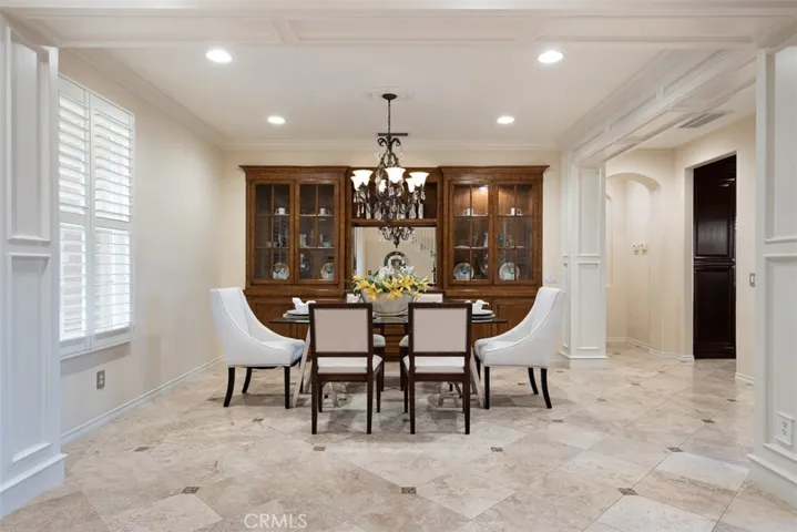 Expansive Formal Dining Room with  Built-In Cabinetry as well as Custom Casement Detailing!