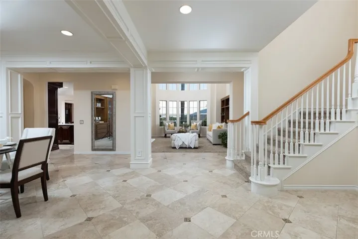 Open Entry features travertine flooring and casement detailing!